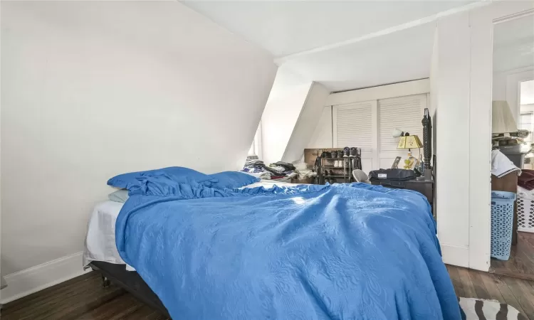 Bedroom featuring dark hardwood / wood-style flooring