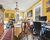 Dining space with dark wood-type flooring