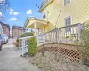 View of home's exterior featuring a porch and cooling unit