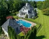 View of pool featuring a lawn and a patio area