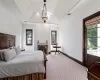 Bedroom with a raised ceiling, carpet floors, vaulted ceiling, and ornamental molding