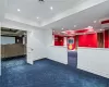 Carpeted spare room with ornamental molding and a tray ceiling