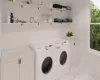 Laundry room featuring washing machine and clothes dryer