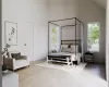 Bedroom featuring light hardwood / wood-style flooring, high vaulted ceiling, and multiple windows