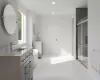 Bathroom with tile patterned flooring, vanity, and an enclosed shower