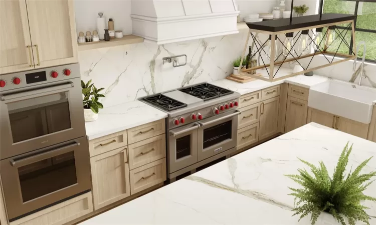 Kitchen featuring tasteful backsplash, multiple ovens, sink, light brown cabinets, and range with two ovens