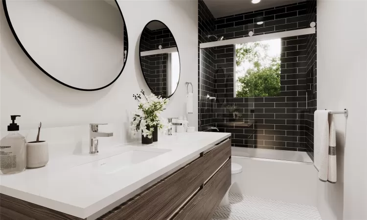 Full bathroom with vanity, toilet, and tiled shower / bath