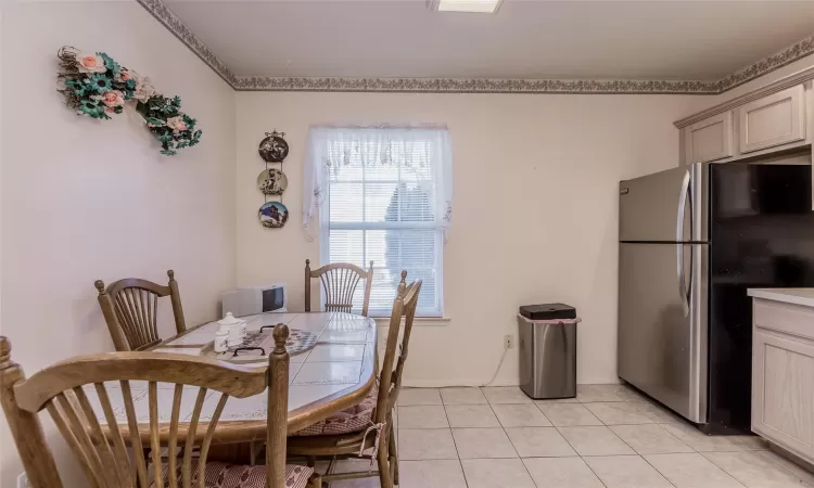 Dining room with light tile patterned floors