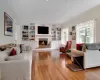 Living room featuring built in shelves and ornamental molding