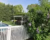 View of yard with a pergola and a swimming pool