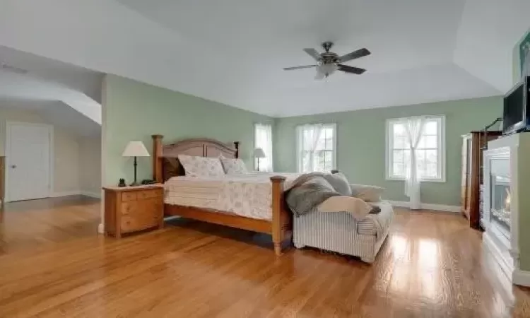 Primary Bedroom featuring light hardwood flooring and ceiling fan