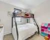 Carpeted bedroom featuring baseboard heating