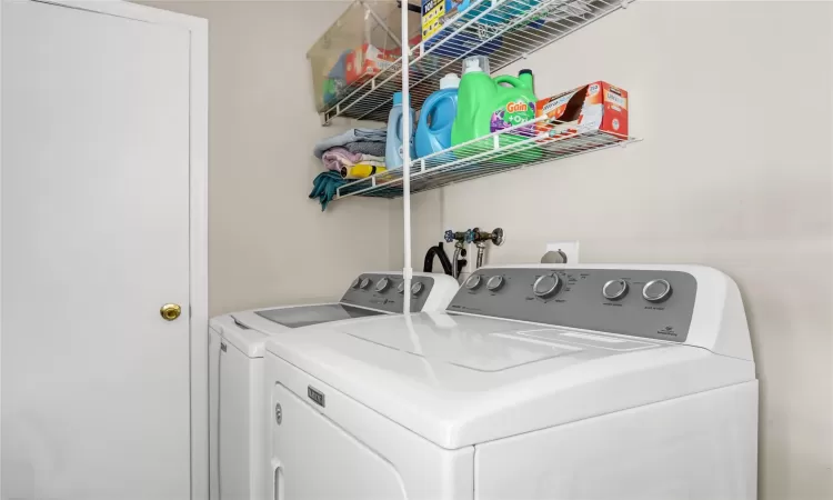 Clothes washing area with washing machine and clothes dryer