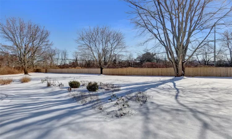 View of yard covered in snow