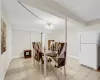 Tiled dining space featuring an inviting chandelier