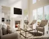 Living room featuring a towering ceiling and a premium fireplace