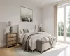 Bedroom featuring access to outside and light hardwood / wood-style flooring