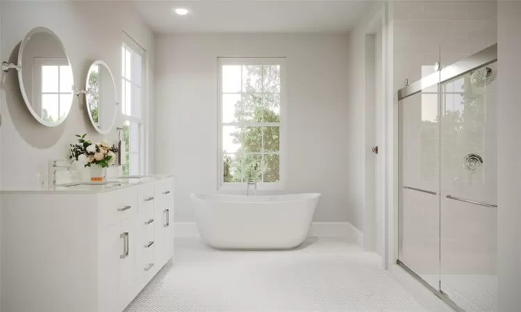 Bathroom featuring shower with separate bathtub and vanity