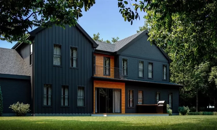 View of front of property featuring a balcony and a front lawn