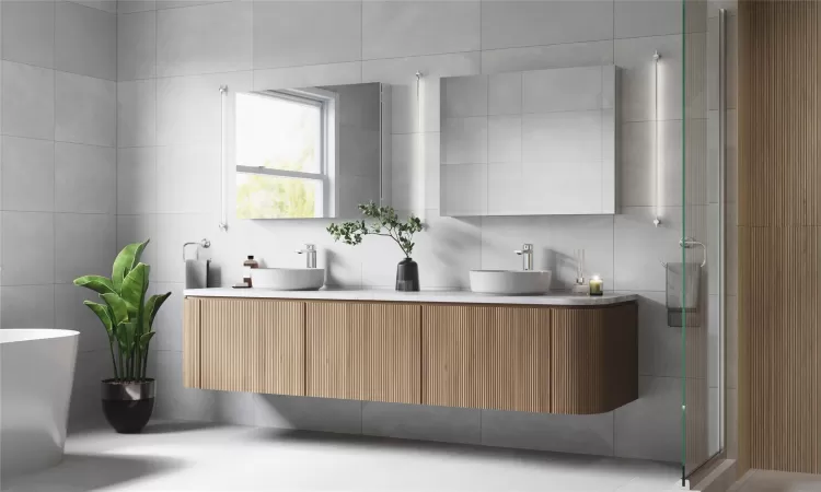 Bathroom featuring vanity, separate shower and tub, and tile walls