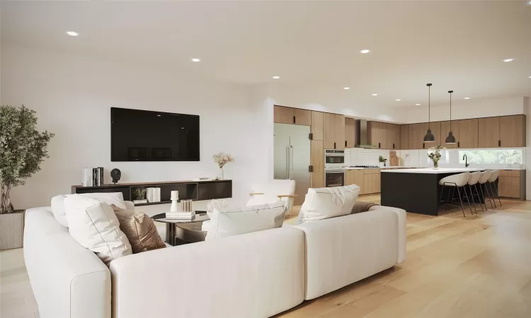 Living room featuring light hardwood / wood-style floors and sink