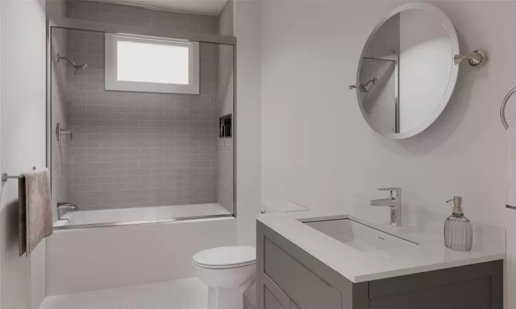 Full bathroom featuring vanity, tiled shower / bath combo, and toilet