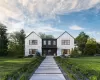 Modern farmhouse featuring a front lawn