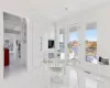 Dining area featuring a water view and light tile patterned flooring