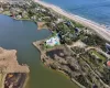 Drone / aerial view with a water view and a view of the beach