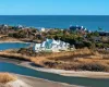 Drone / aerial view with a water view and a view of the beach