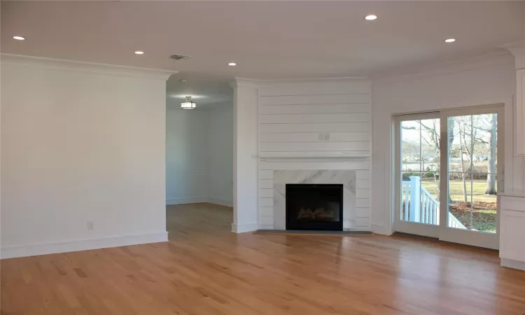 Hallway with light hardwood / wood-style floors