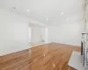 Unfurnished living room with light wood-type flooring