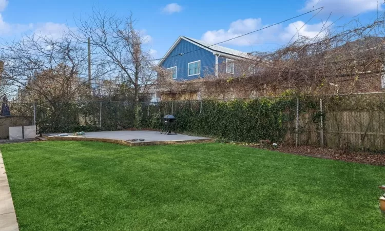 View of yard with a patio