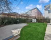 View of yard featuring a storage unit and a patio