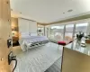 Bedroom with wood-type flooring and crown molding