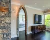 Hallway featuring ornamental molding and dark wood-type flooring