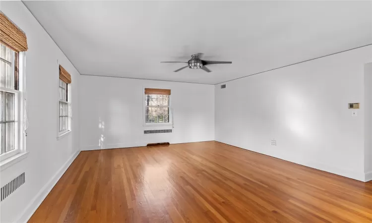 Spare room with ceiling fan and hardwood / wood-style flooring