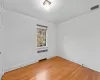 Unfurnished room with hardwood / wood-style floors