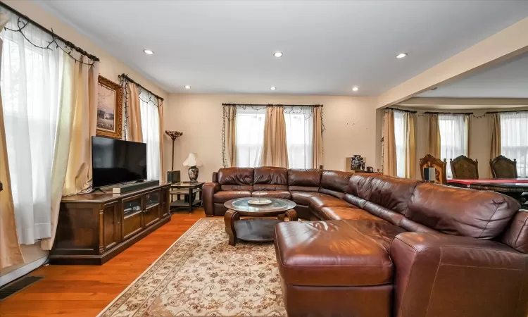 Living room with light hardwood / wood-style flooring