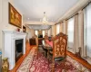 Dining space with light hardwood / wood-style floors and an inviting chandelier