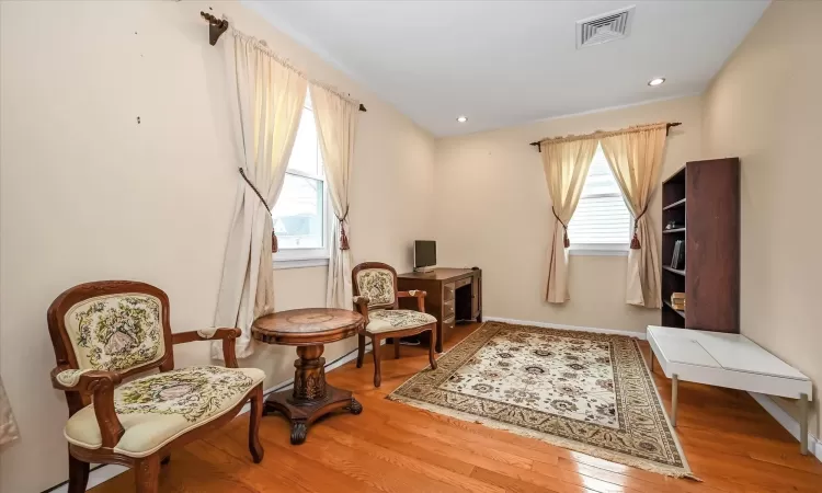 Sitting room featuring hardwood / wood-style floors