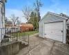 Garage featuring a lawn