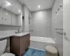 Kitchen with tasteful backsplash, white cabinetry, sink, and appliances with stainless steel finishes