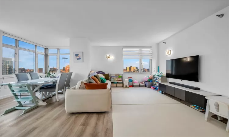 Living room with light hardwood / wood-style flooring