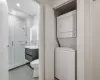 Full bathroom with tile walls, toilet, decorative backsplash, vanity, and shower / bathtub combination