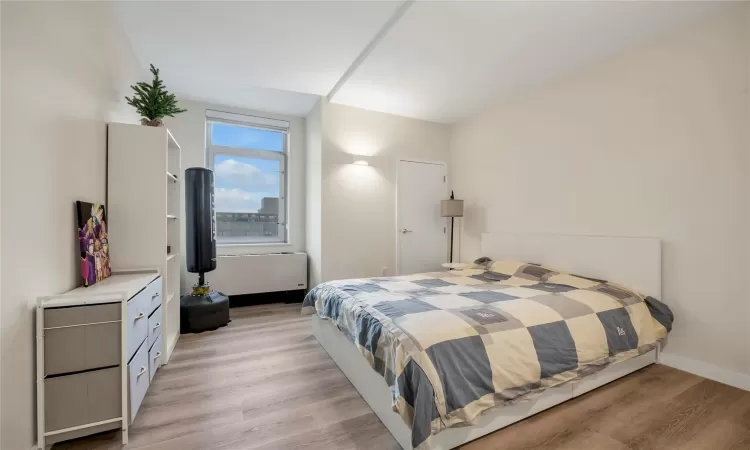 Bedroom featuring dark hardwood / wood-style floors