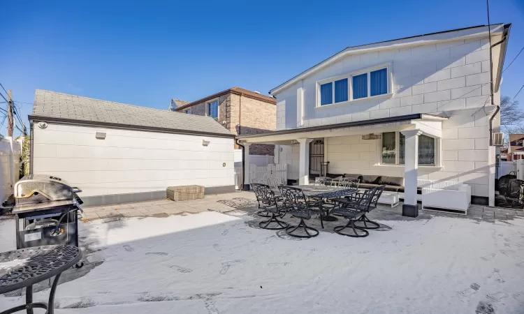 Back of house with a patio