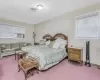 Carpeted bedroom with cooling unit