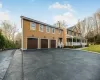 View of front of house with covered porch and a garage