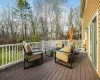 Wooden terrace featuring an outdoor hangout area